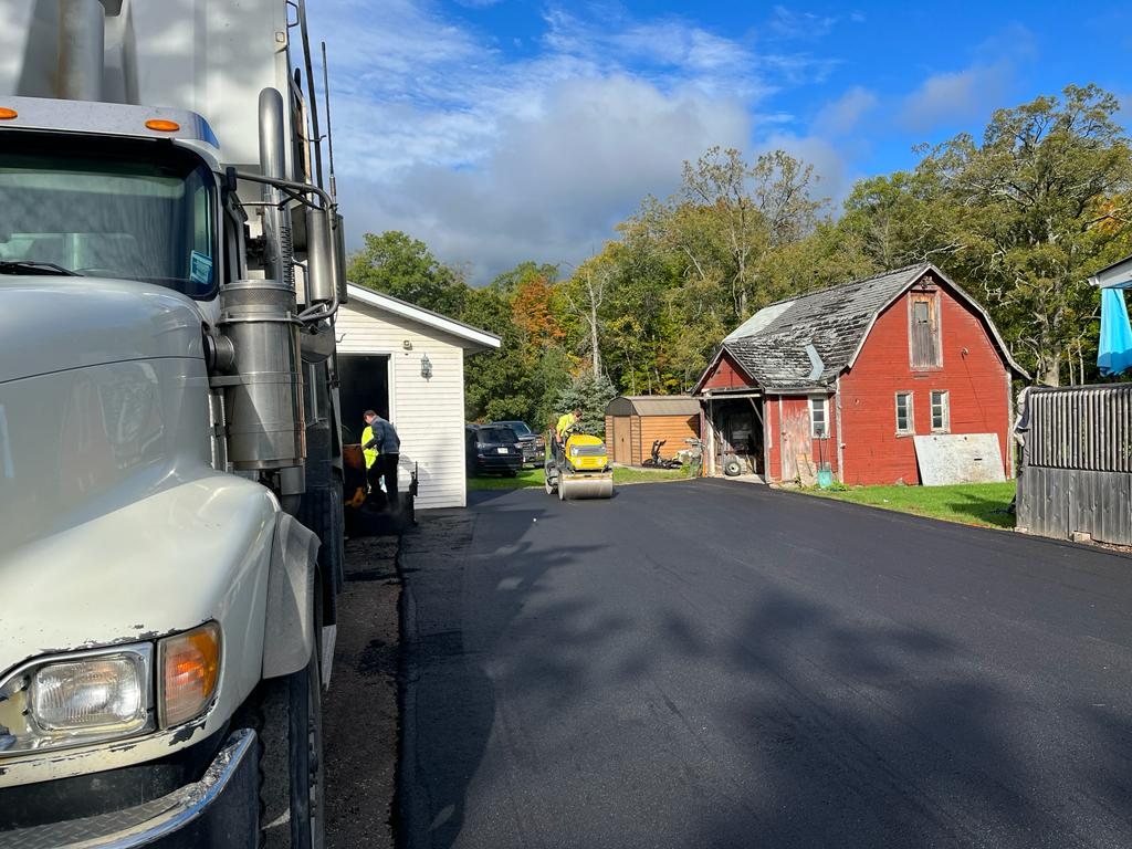 Genesis team finishing up with a residential paving job