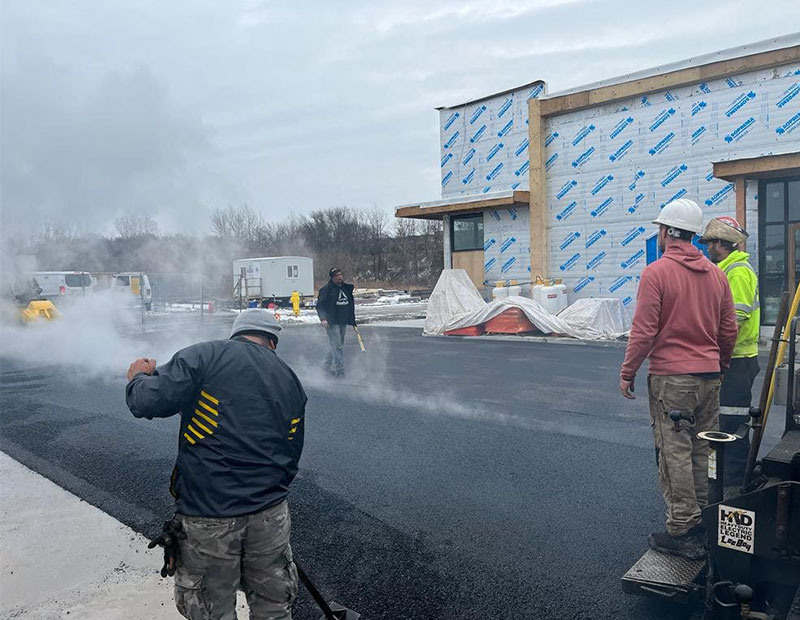 Genesis paving team working at a commercial site