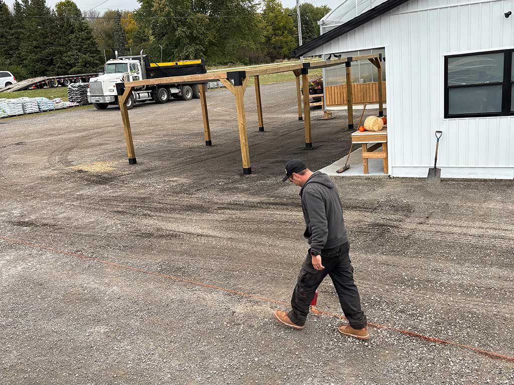 Base layer of gravel and lines being put out at Mike and Lori's Garden Centre