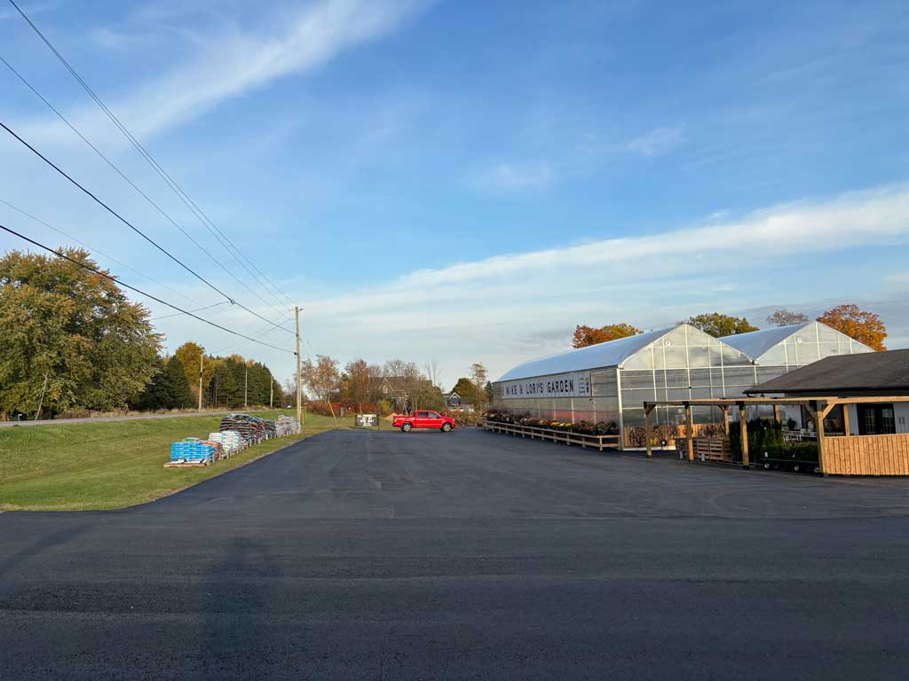 Commercial pave completed at Mike and Lori's Garden Centre, showing the front parking area from the side