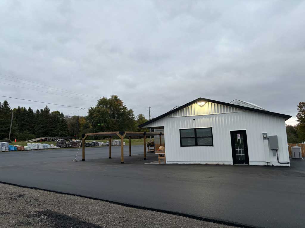 Commercial pave completed at Mike and Lori's Garden Centre showing the building from the side
