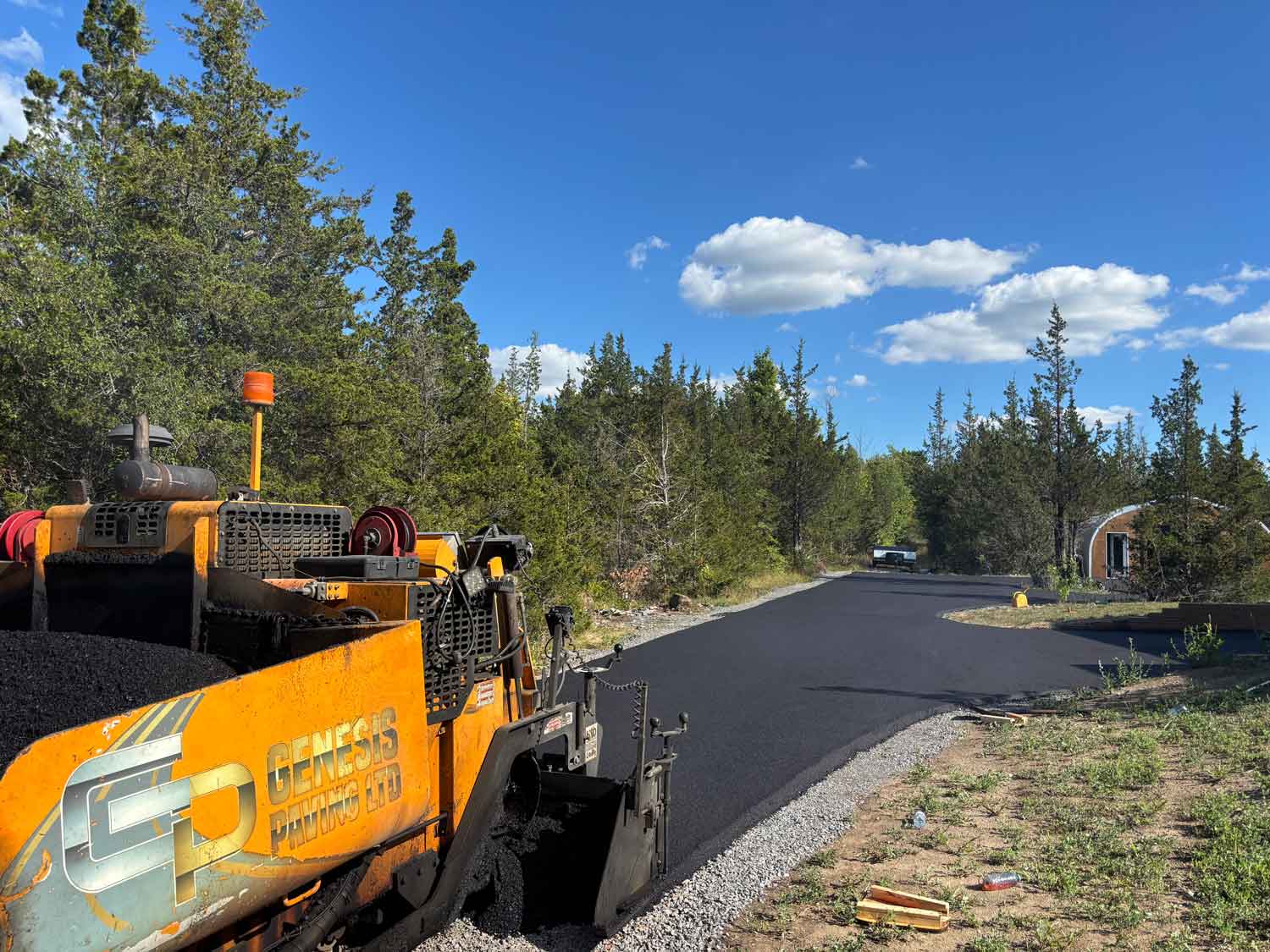 Genesis Paving equipment paving residential driveway