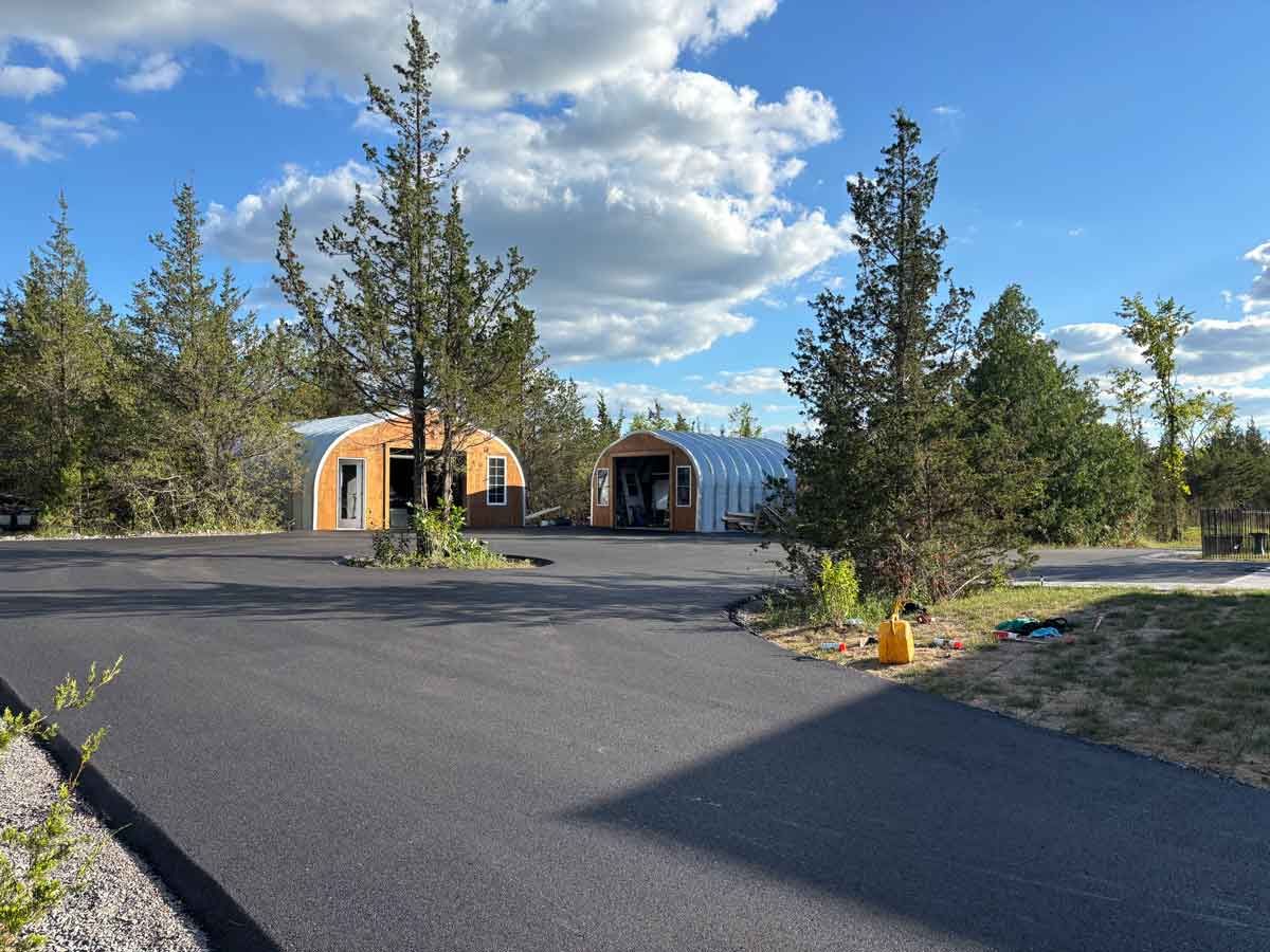 Residential paved driveway connecting shop and home